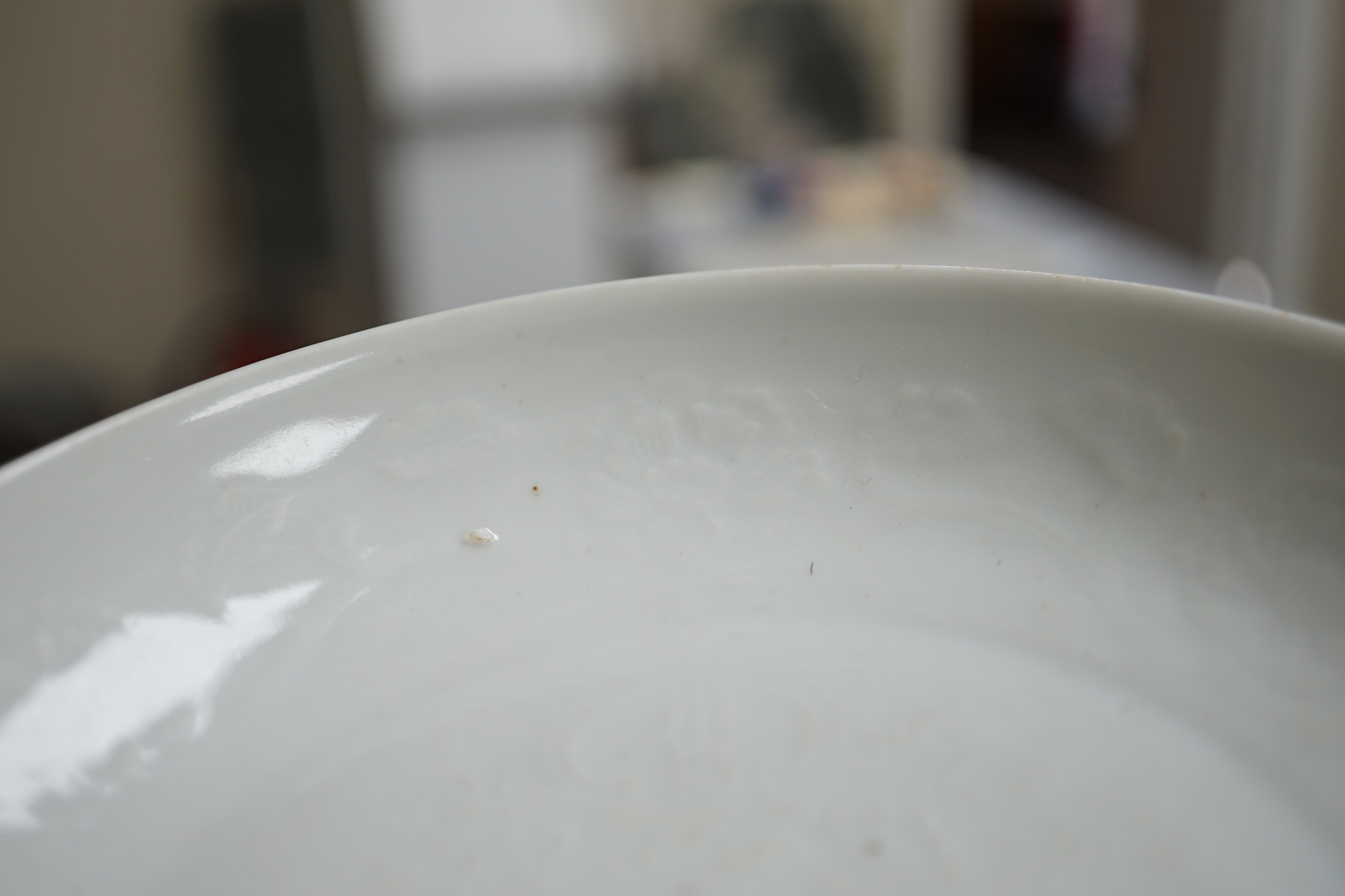A Chinese moulded white glazed saucer dish, Yongle mark, Republic period